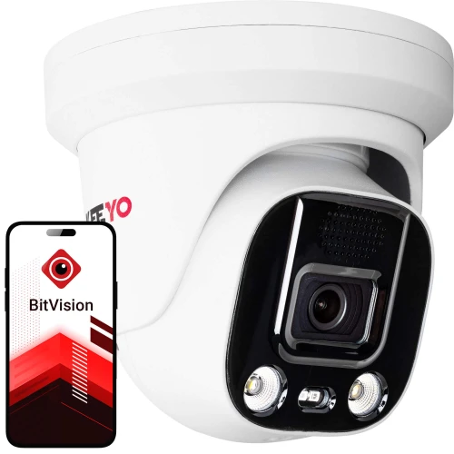 Na zdjęciu znajduje się biała, kopułowa kamera IP z widocznym obiektywem i diodami LED na czarnym tle. Obok kamery pokazany jest smartfon z aplikacją BitVision na ekranie.