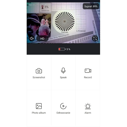 Zrzut ekranu przedstawia interfejs aplikacji monitoringu z podglądem kamery, gdzie widać testowy obraz z wzorcem ostrości i liniowości. Na dole ekranu znajdują się ikony funkcji, takie jak zrzut ekranu, mówienie, nagrywanie, album zdjęć, odtwarzanie i alarm.