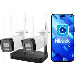 Na zdjęciu znajdują się dwie białe kamery monitoringu HiLook oraz czarny rejestrator, obok których widoczny jest smartfon z aplikacją HiLook na ekranie. Kamery mają anteny do bezprzewodowej komunikacji, a tło jest białe.